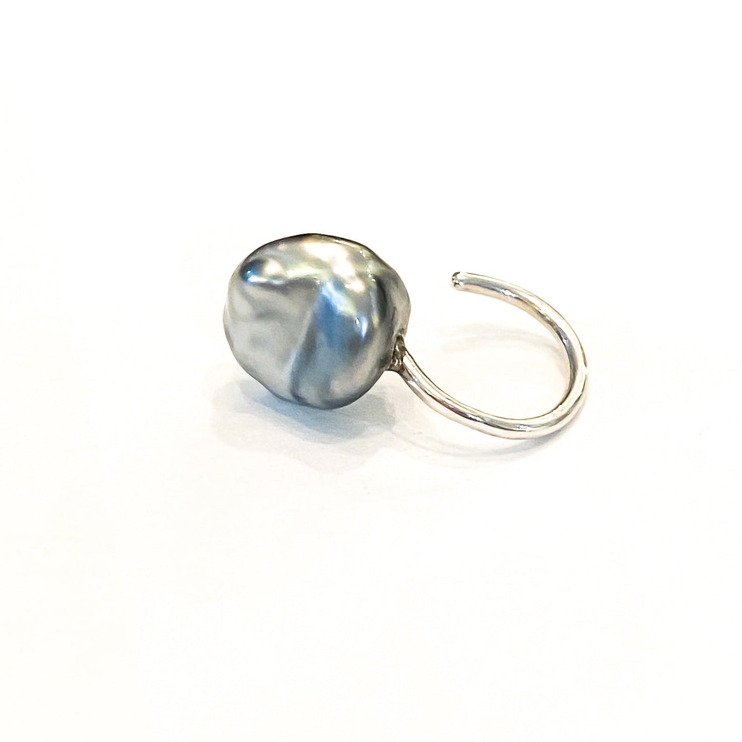 Keshi Cuff silver pearl earrings, left view.