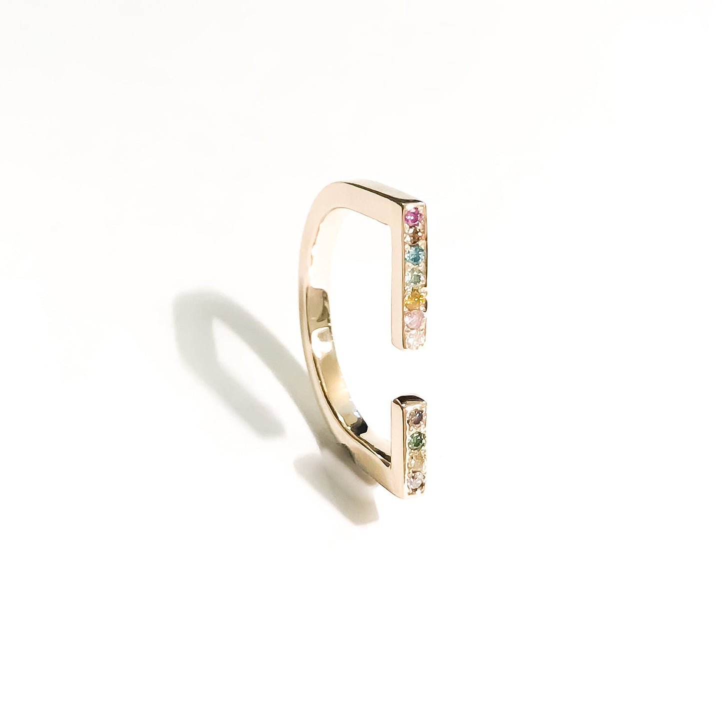 Rainbow 14 kt gold diamond ring, side view.