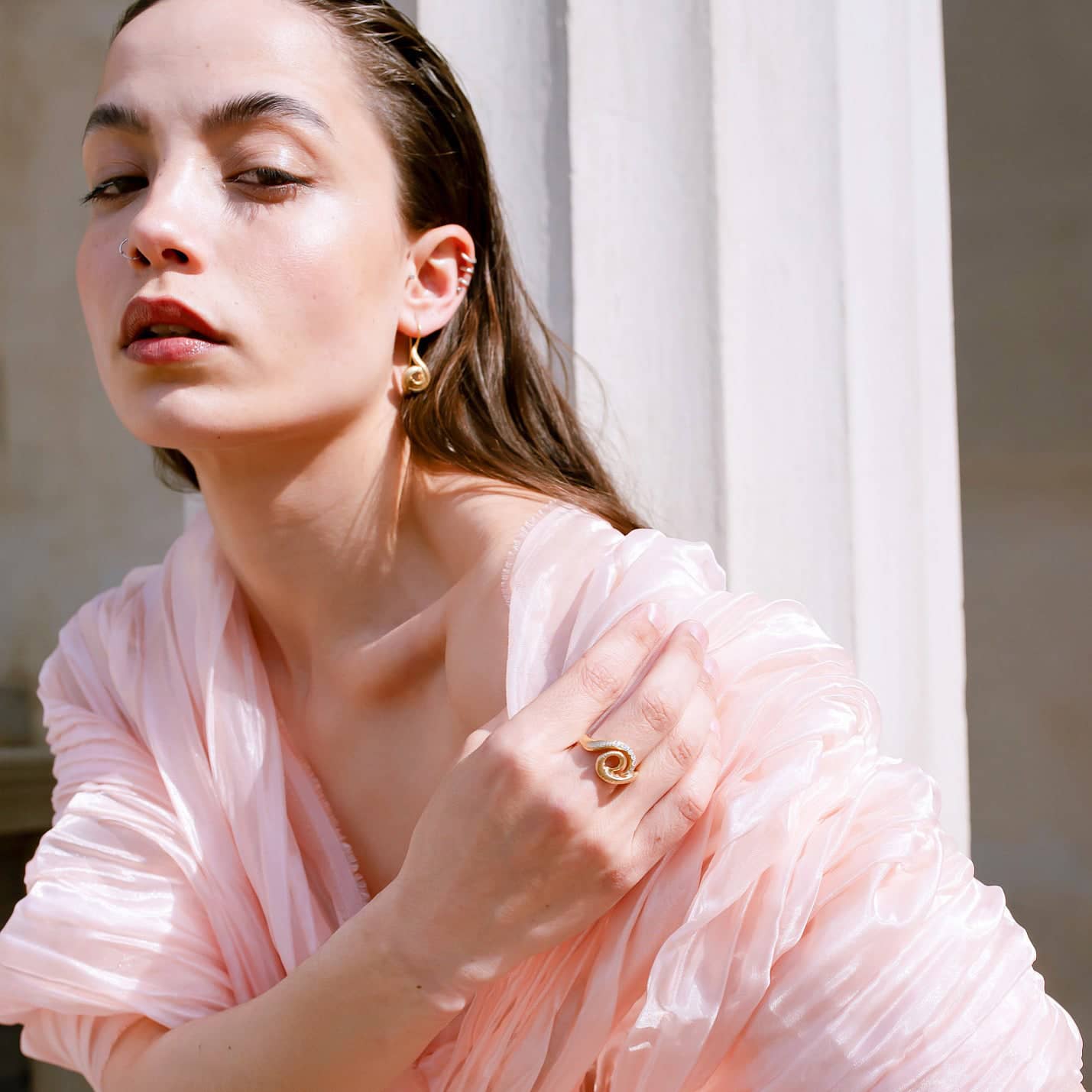Surrea gold plated silver earrings on model.