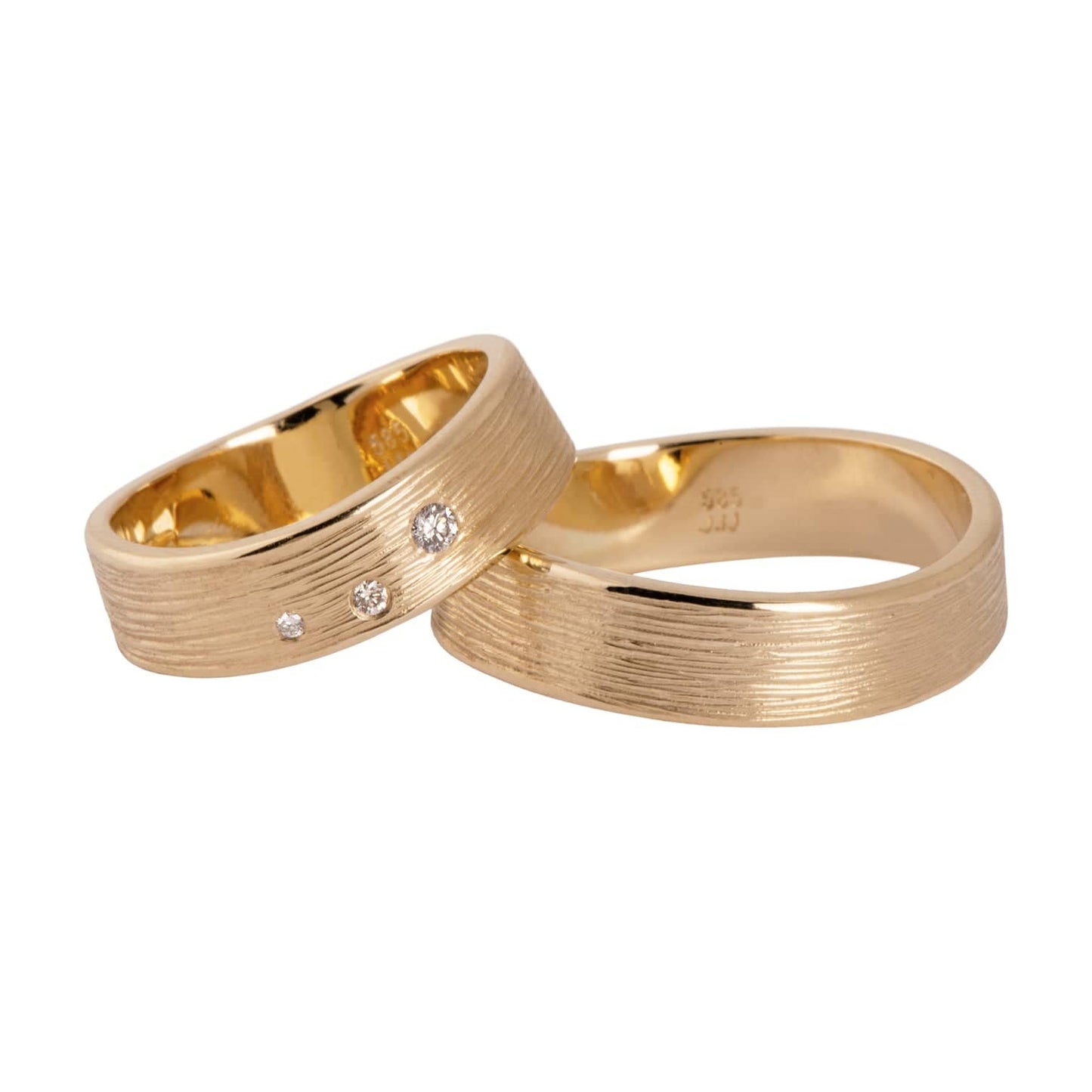 Waves 14 kt gold diamond wedding rings, front view.