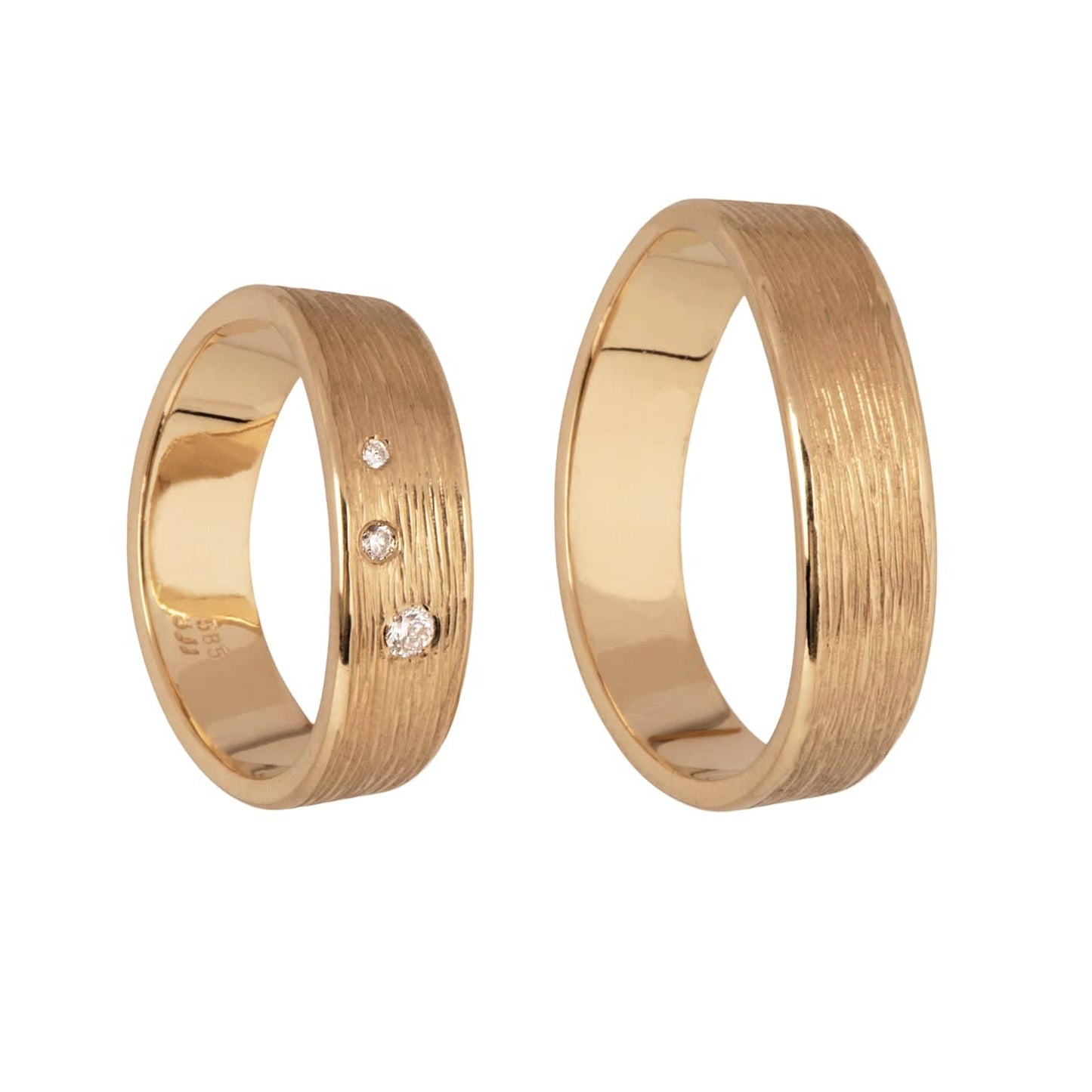 Waves 14 kt gold diamond wedding rings, side view.