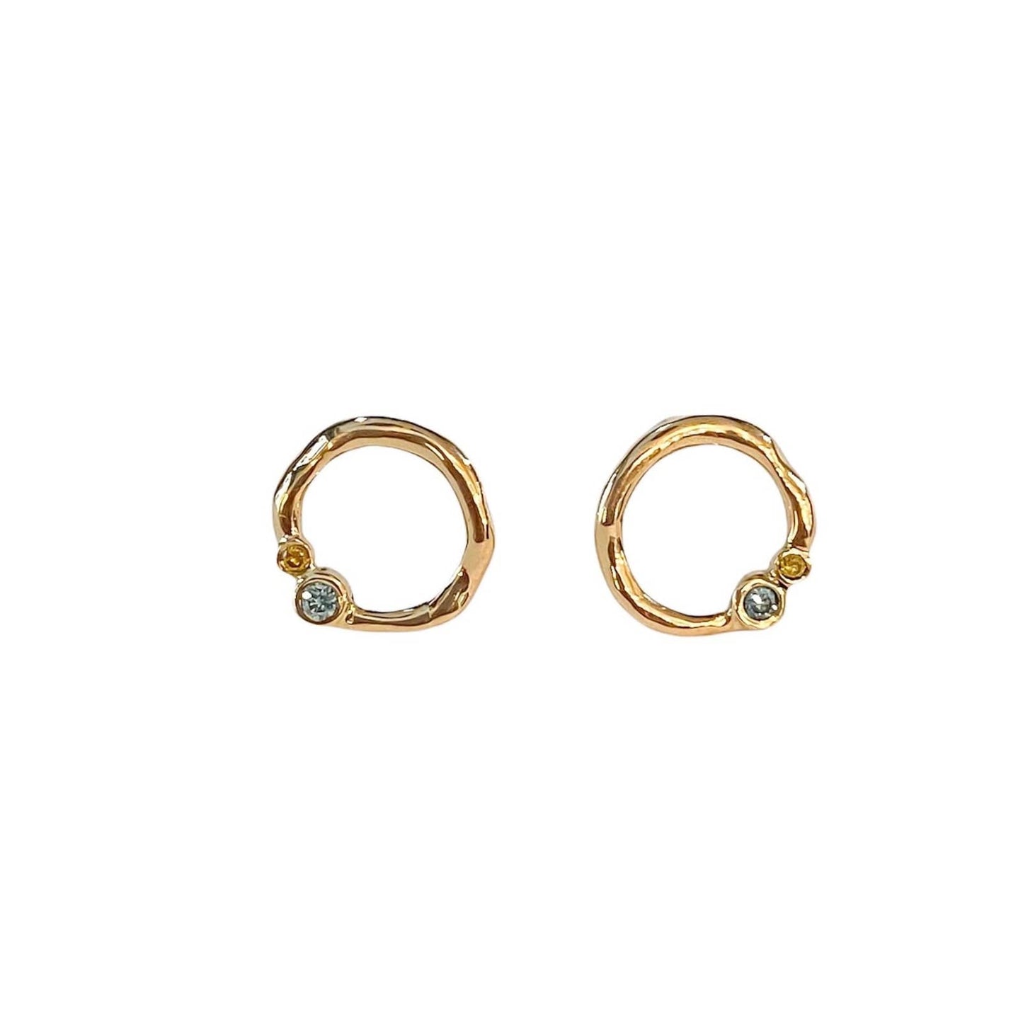 Curves 14 kt gold diamond earrings.