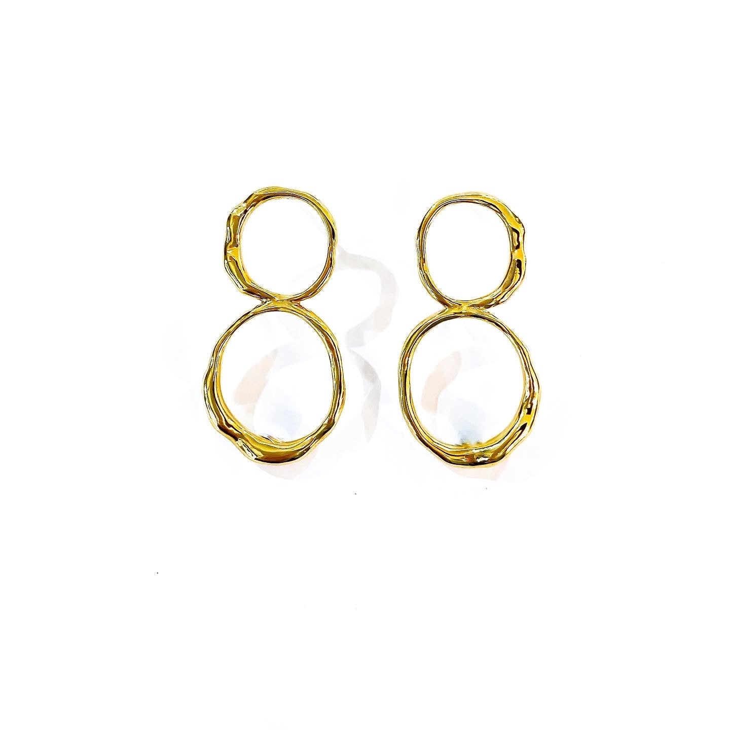Curves Big gold earrings.