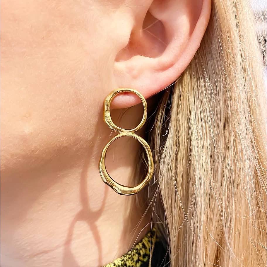 Curves Big gold earrings on model.