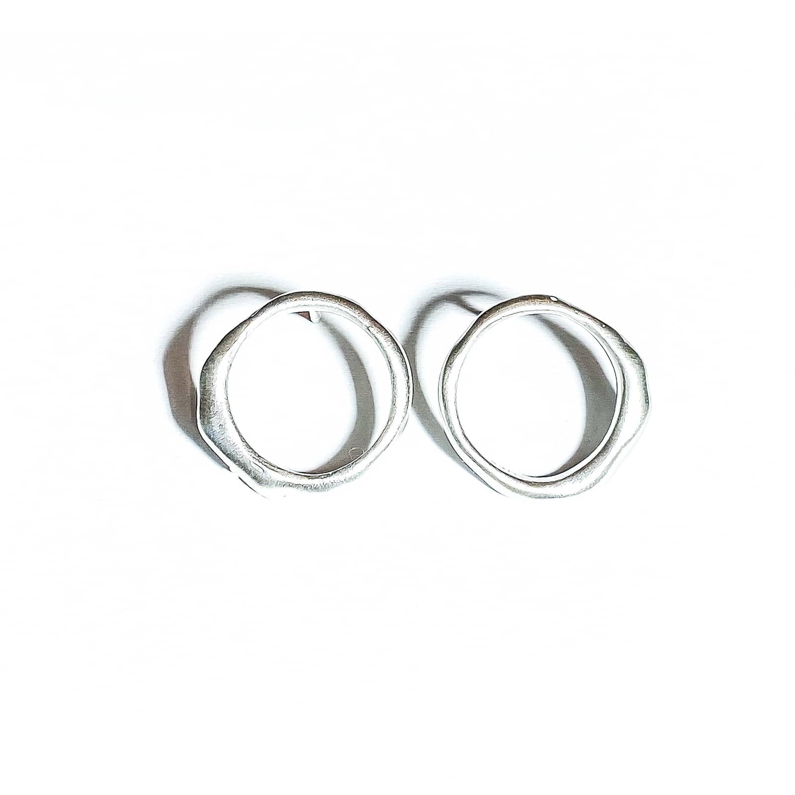 Curves Collection small silver earrings.