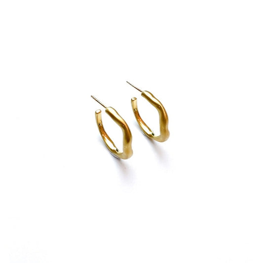 Curves Creole gold plated silver earrings, left side view.