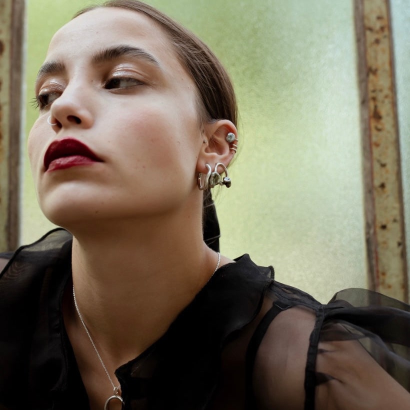 Keshi Curves Hoops silver pearl earrings on model.