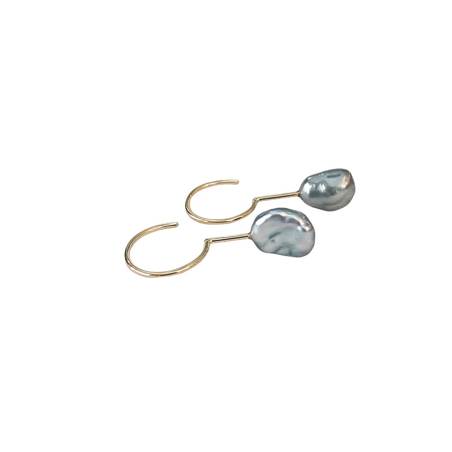Simple Keshi Small 14 kt gold earrings, top view.