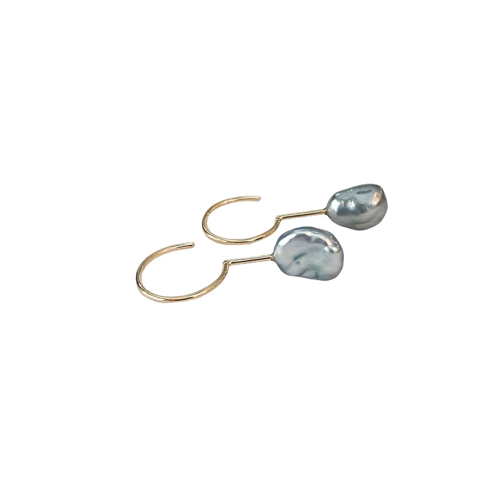Simple Keshi Small 14 kt gold earrings, top view.