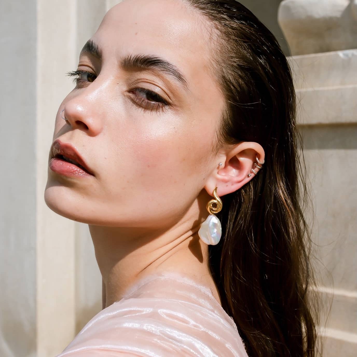 Surrea Baroque gold plated silver earrings on model.